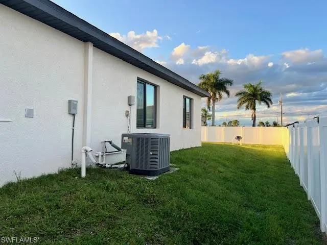 View of yard with central AC
