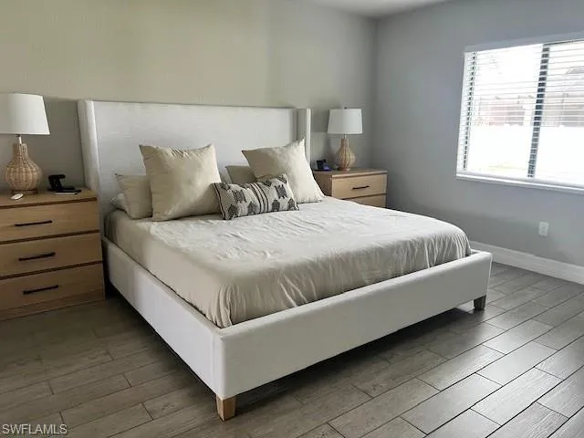 Bedroom featuring dark wood-type flooring