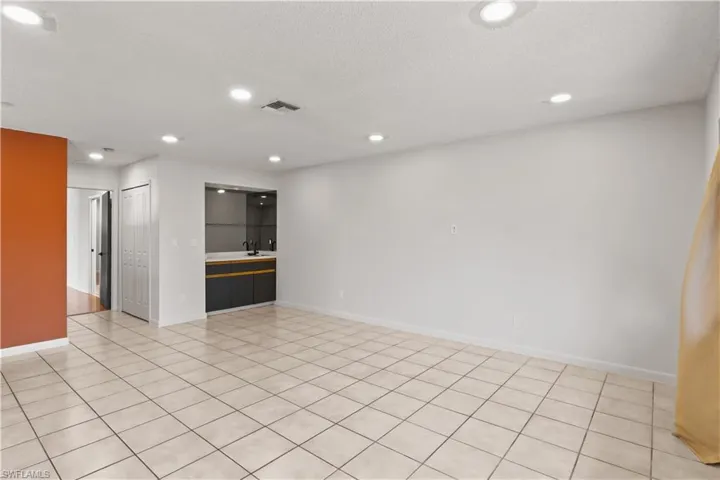 Spare room with recessed lighting, light tile patterned floors, and a textured ceiling