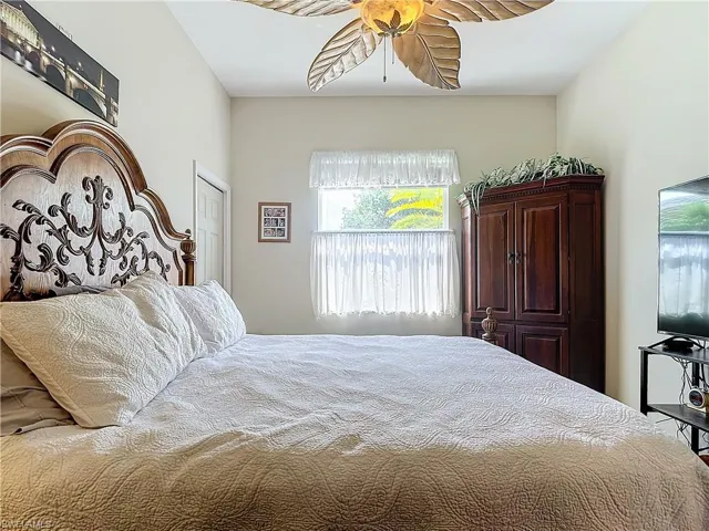 Bedroom featuring a closet and ceiling fan