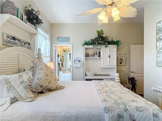 Bedroom with ensuite bath and ceiling fan
