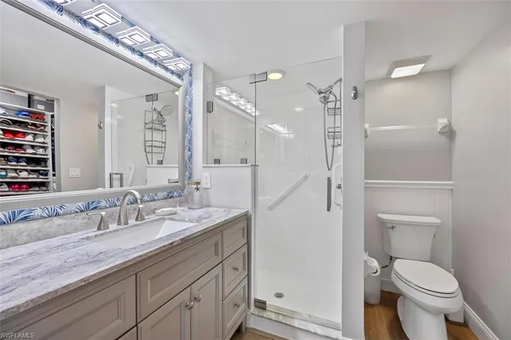 Primary bathroom with custom shower enclosure