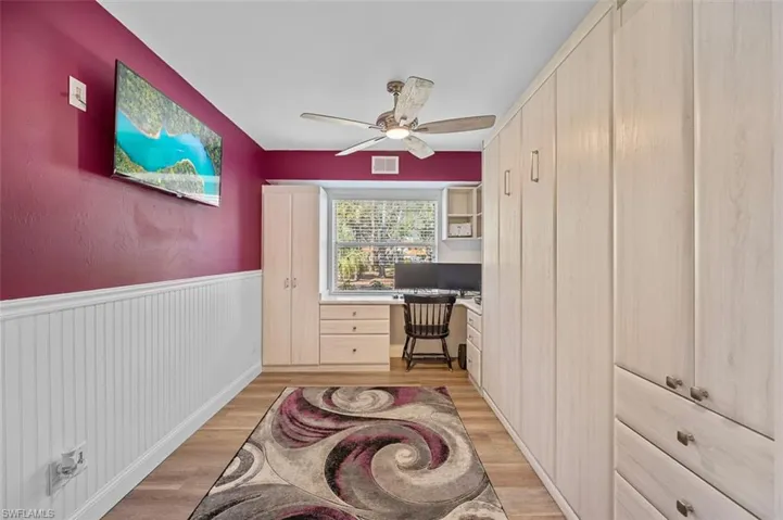 Bonus room (den or 3rd bedroom) featuring built in office space and pull-down Murphy bed