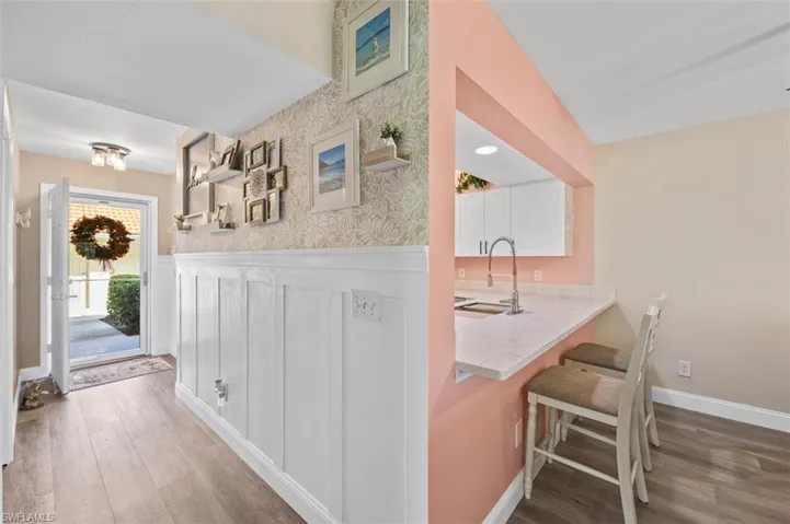 Hallway from front door with feature wall