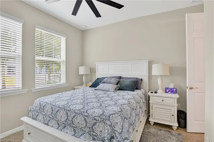 Bedroom featuring ceiling fan and light tile patterned floors