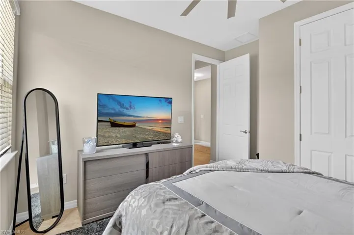 Bedroom featuring baseboards and ceiling fan