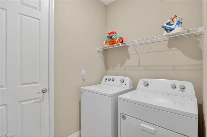 Laundry room featuring separate washer and dryer