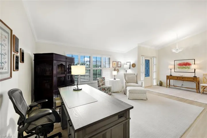 Living Room With Foyer- Currently Used as an Office- Plantation Blinds Throughout