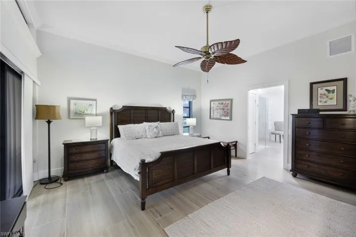 View II of Primary Bedroom- Shown with a King Size Bed, View into Captive Spa Bathroom and Closet Room