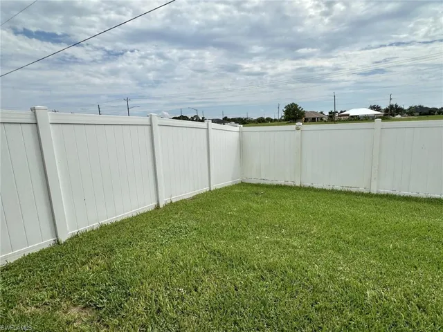 2306 view of white vinyl fenced yard and divider