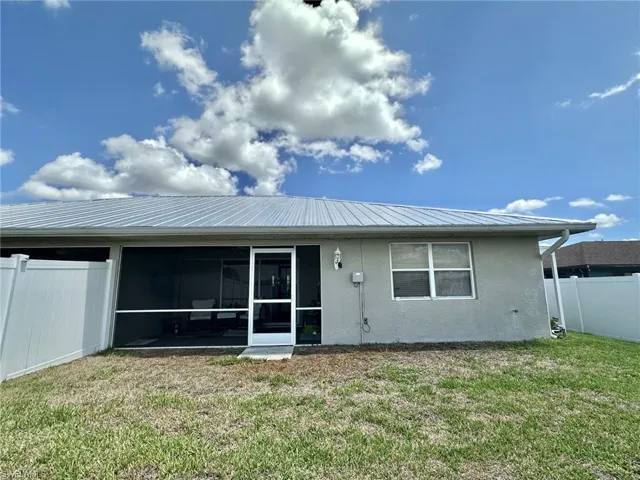 2308 yard with screened lanai under truss and primary ensuite double windows