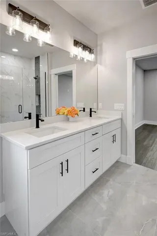Bathroom with vanity and an enclosed shower
