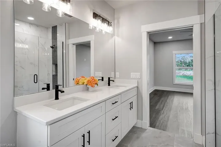 Bathroom featuring vanity and walk in shower