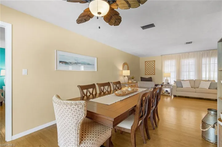 Dining space featuring light wood-type flooring and ceiling fan