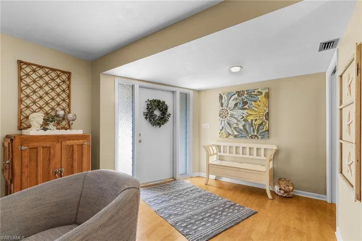 Foyer entrance featuring light hardwood / wood-style flooring