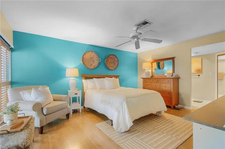 Bedroom featuring light hardwood / wood-style floors and ceiling fan