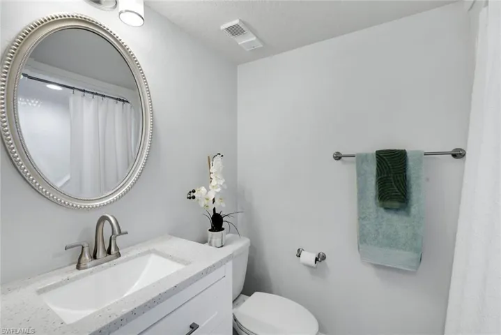 Bathroom #2 featuring vanity, toilet and tub/shower