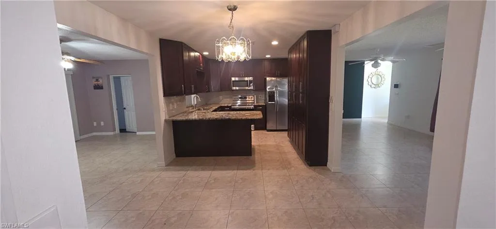 Kitchen with dining room, Living room to the right and family room to the left