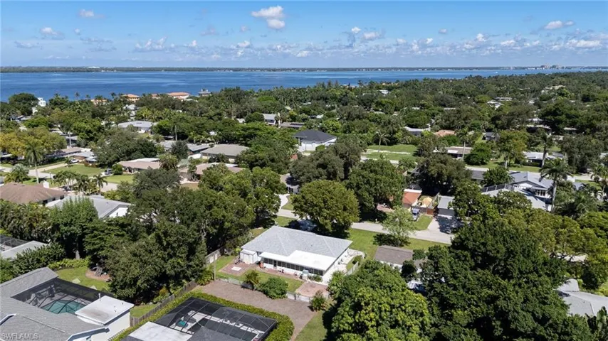 Aerial view of residential area featuring a nearby Caloosahatchee River.