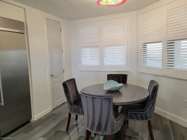 Dining space featuring wood tiled floors