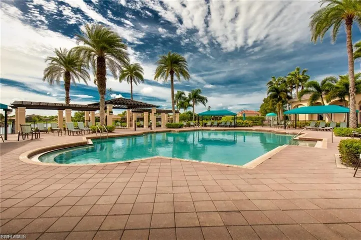 Community pool with a patio area