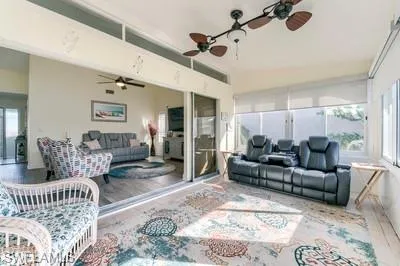 Sunroom / solarium featuring wood finished floors
