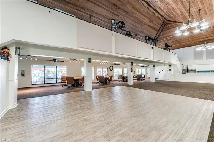Misc room with high vaulted ceiling, healthy amount of natural light, and wood ceiling