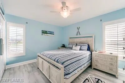 Bedroom featuring light wood-type flooring and ceiling fan