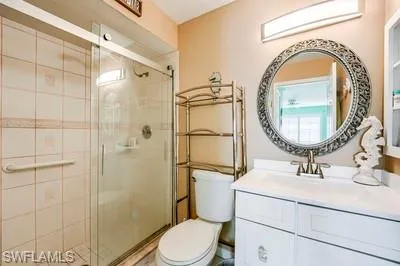 Full bathroom featuring vanity and a stall shower