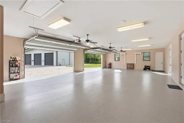 Four car attached, air-conditioned garage with guest bath and storage closet.