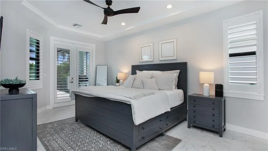 Bedroom with access to exterior, ceiling fan, and crown molding