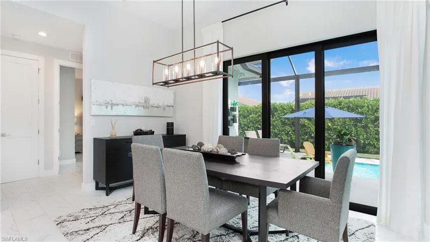 Dining area with an inviting chandelier