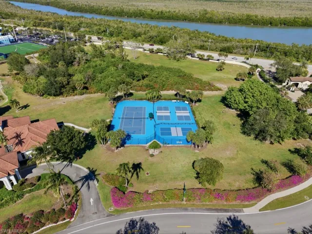 Bird's eye view Key Marco Community Clubhouse - Social Room with Screened Lanai, Bar, and Catering Kitchen, Exercise Room, Tennis Court, 3 Pickleball Court, and Dog Park