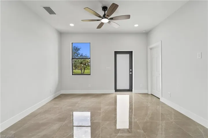 Unfurnished room featuring recessed lighting and a ceiling fan