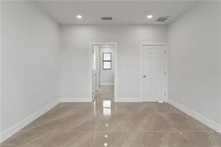 Empty room featuring recessed lighting