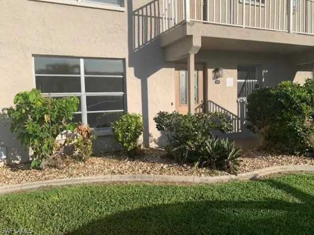 Community pool with a patio