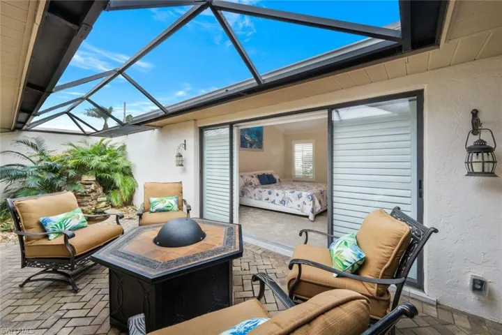 View of patio with a lanai