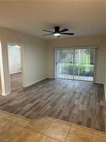 Spare room with hardwood / wood-style floors and ceiling fan