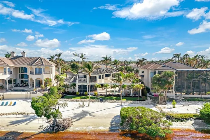 Bac if house (the one in the middle) featuring the private beach