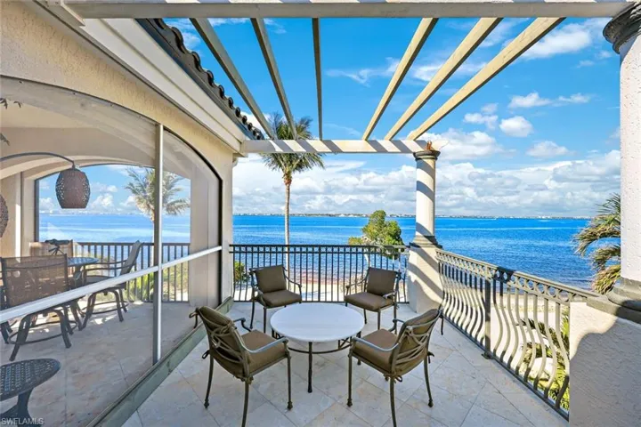 View of the owners suite Sundeck off of the private Lanai adjacent to the owners suite. Featuring a water view of the river and your private beach below.