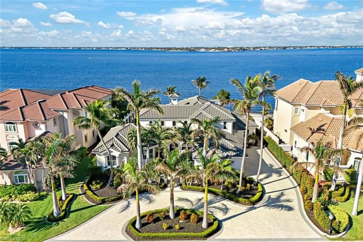 Bird's eye view featuring a water view of this stunning property with your private beach in the sought after Gulf Harbour Yacht & Country Club! Memberships are available.