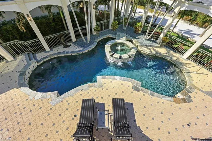 View of pool featuring an in ground hot tub