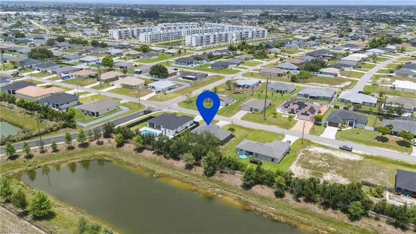 Aerial overview of property's location featuring a large body of water
