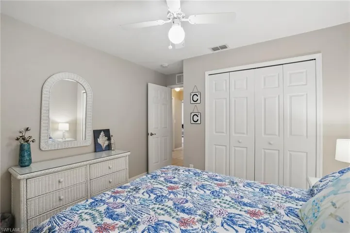 Bedroom featuring a closet and ceiling fan