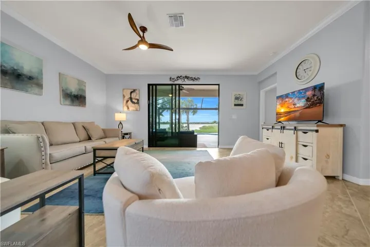 Spacious interior with neutral wall tones and crown molding