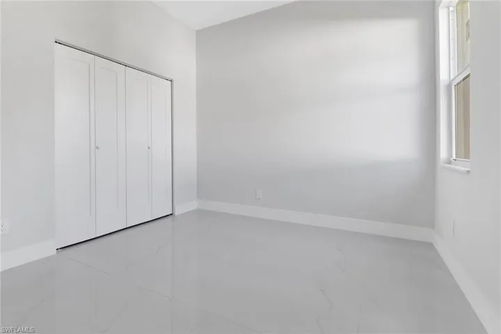 Unfurnished bedroom featuring a closet