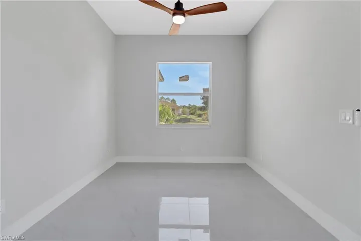 Spare room featuring ceiling fan