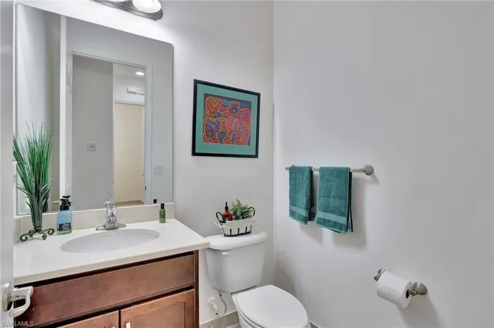 Half bath with vanity and toilet