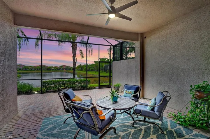 Sunroom / solarium with a water view