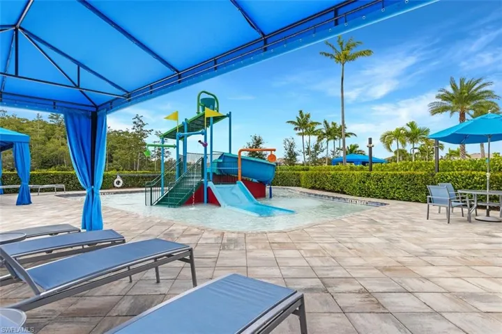 Community jungle gym with a patio